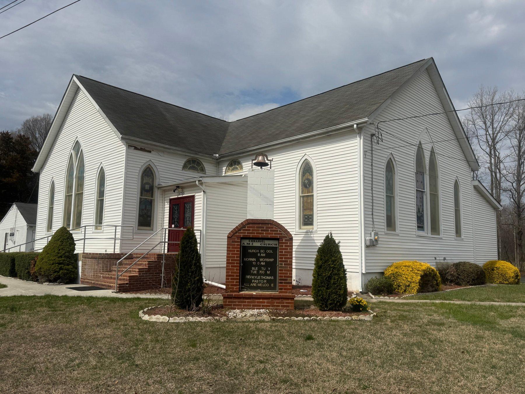Emmanuel AME Church, a white church with stained-glass windows and a red front door